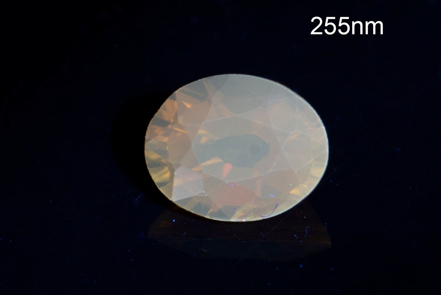 Orange tourmaline dravite 0.45ct fluorescent oval cut