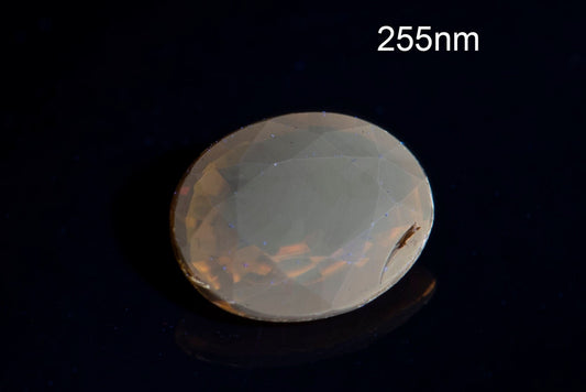 Orange tourmaline dravite 0.41ct fluorescent oval cut