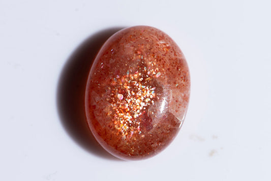 Confetti sunstone 13ct oval cabochon