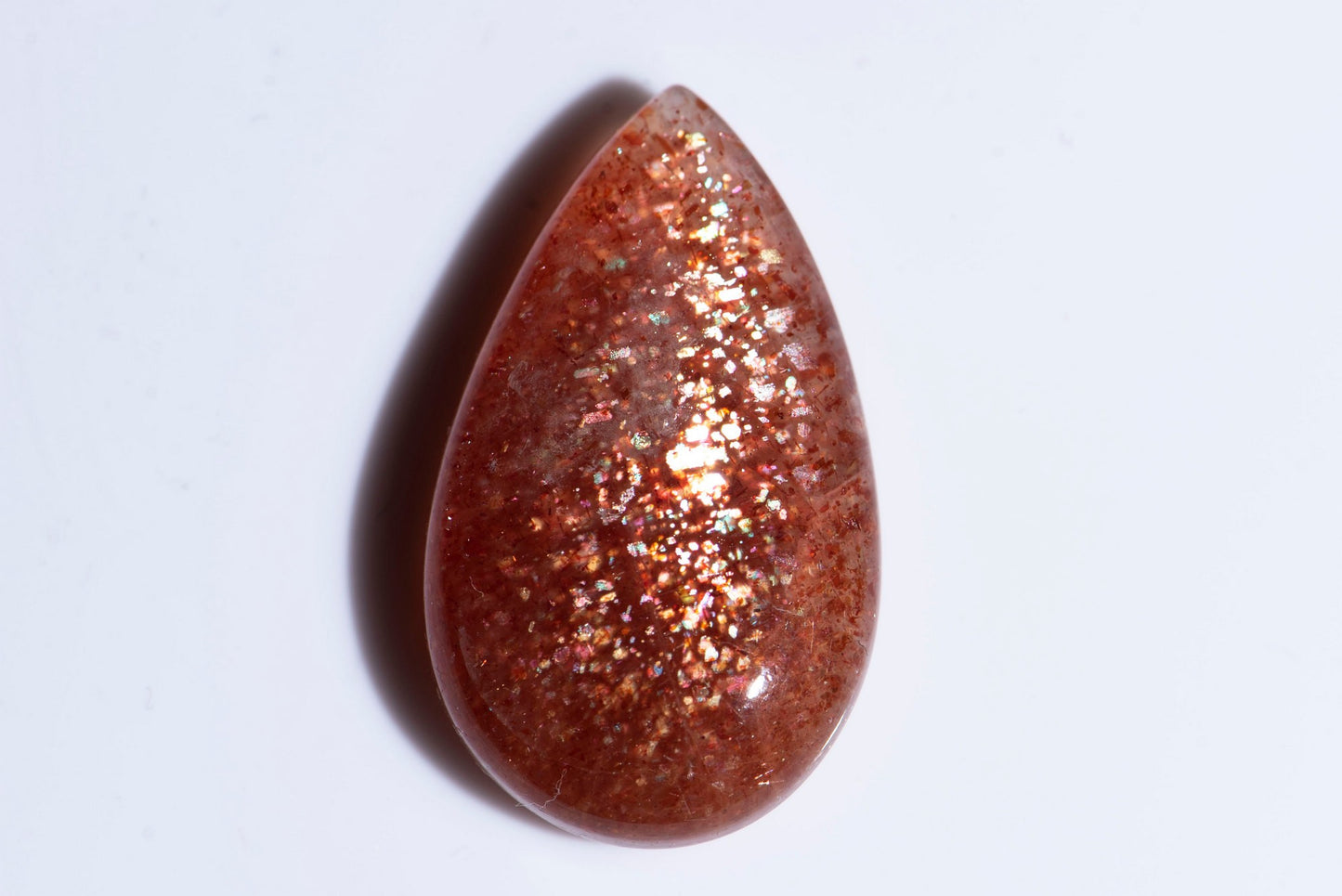Big sunstone confetti 32.6ct teardrop cabochon