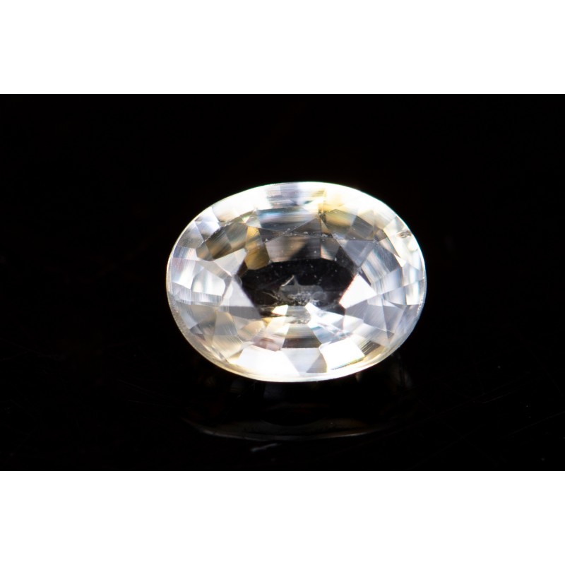 Light yellow sapphire 0.60ct VS oval cut orange fluorescence