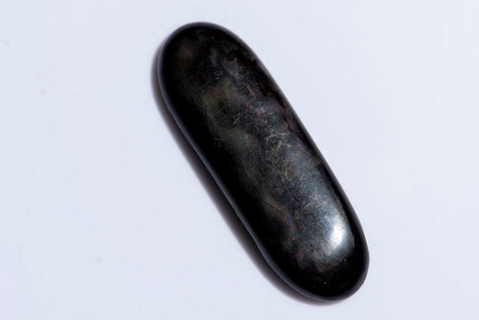 Черно опализирано дърво 13.34ct овален кабошон
