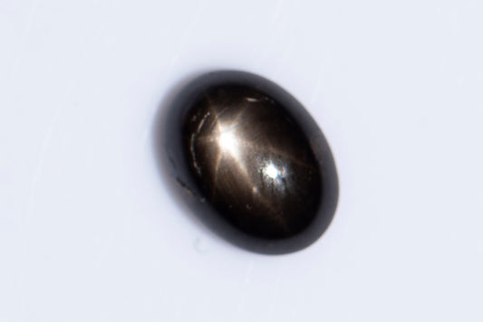 Black star sapphire 1.35ct 6-ray star oval cabochon