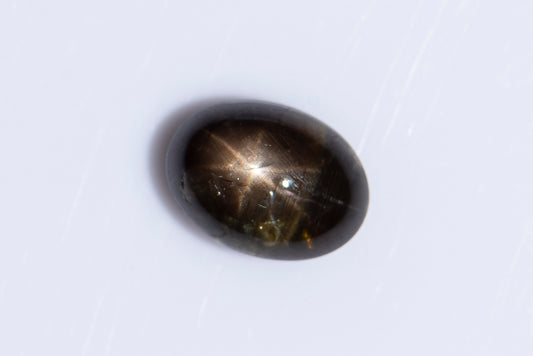 Black star sapphire 1.40ct 6-ray star oval cabochon