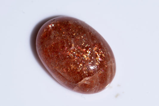 Confetti sunstone 13.7ct oval cabochon