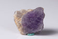 Natural hackmanite 18.1g before ultraviolet exposure, cream matrix with a violet zone