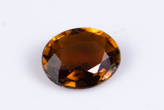 Orange tourmaline dravite 0.41ct fluorescent oval cut
