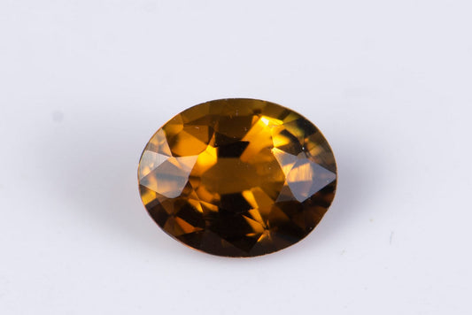 Orange tourmaline dravite 0.45ct fluorescent oval cut