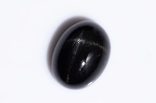 Black star diopside 2.47ct 9x7mm oval cabochon
