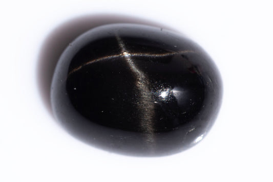 Black star diopside 2.89ct 9x7mm oval cabochon