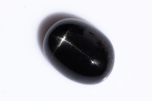 Black star diopside 2.60ct 9x7mm oval cabochon
