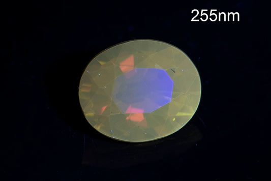 Orange tourmaline dravite 0.46ct fluorescent oval cut