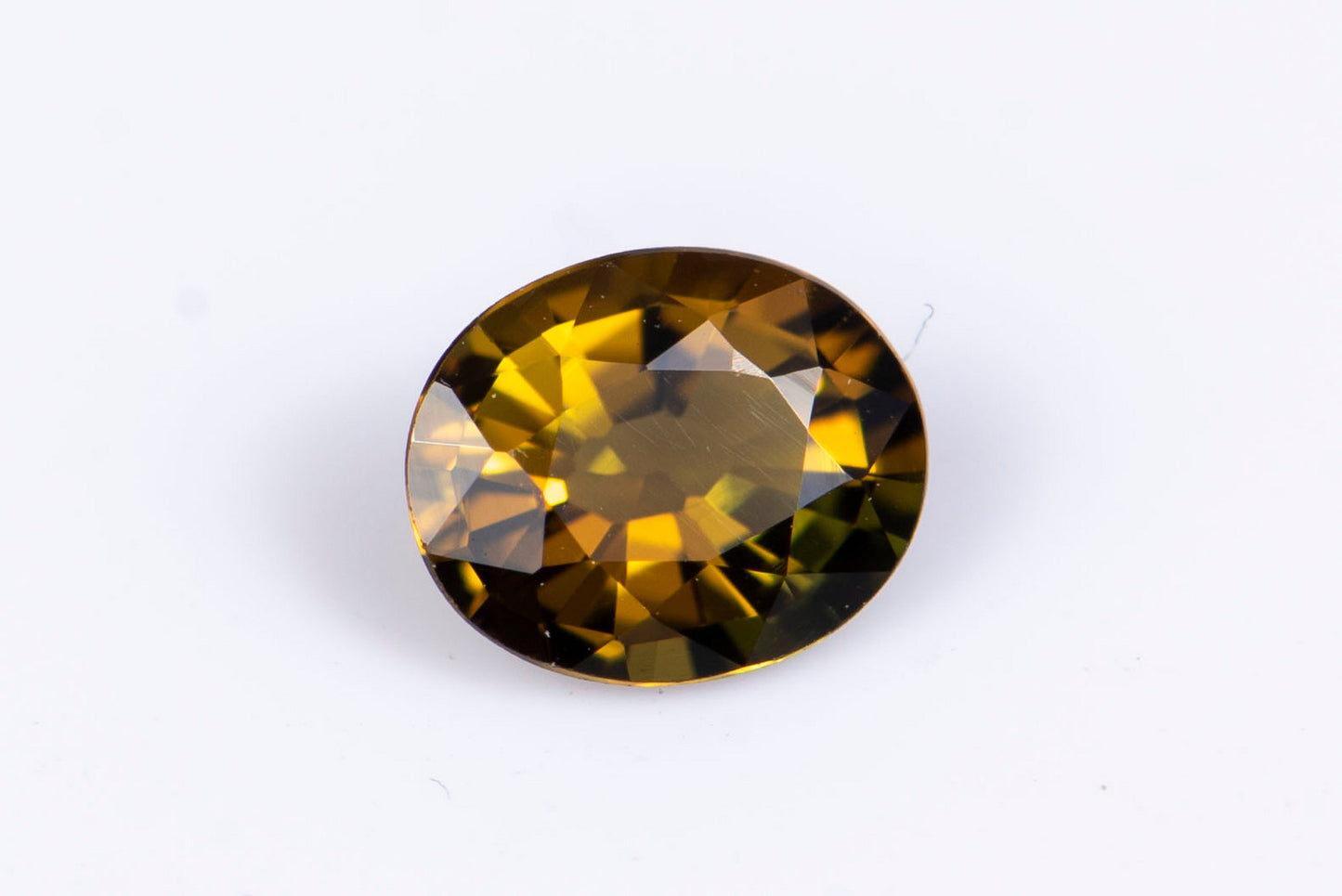 Orange tourmaline dravite 0.46ct fluorescent oval cut