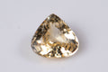 Естествен жълт цейлонски сапфир 0.45ct капковидна шлифовка, топло шампанско жълто на бял фон